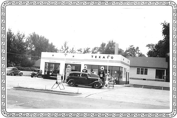 vintage 1930s cars at a Texaco, black and white photo