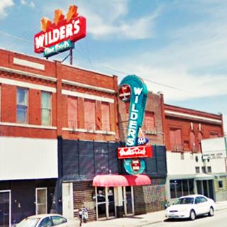 Wilders Steakhouse neon signs on red brick building